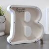 Balta taupyklė raidė B